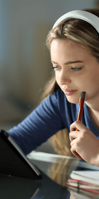 Women studying eLearning and making notes